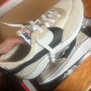 Nike sneakers. Woman’s size 8.5. Brand new in box.